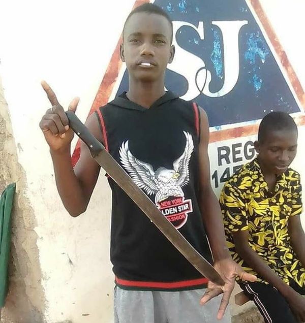 boy pictured with machete minutes before stabbing another to death